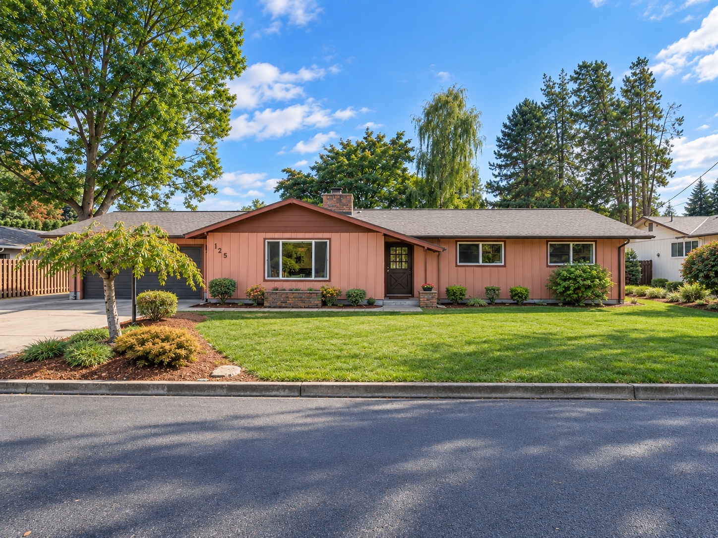 Front exterior of the single-level ranch home at 125 NW 11th Ave in Canby, Oregon